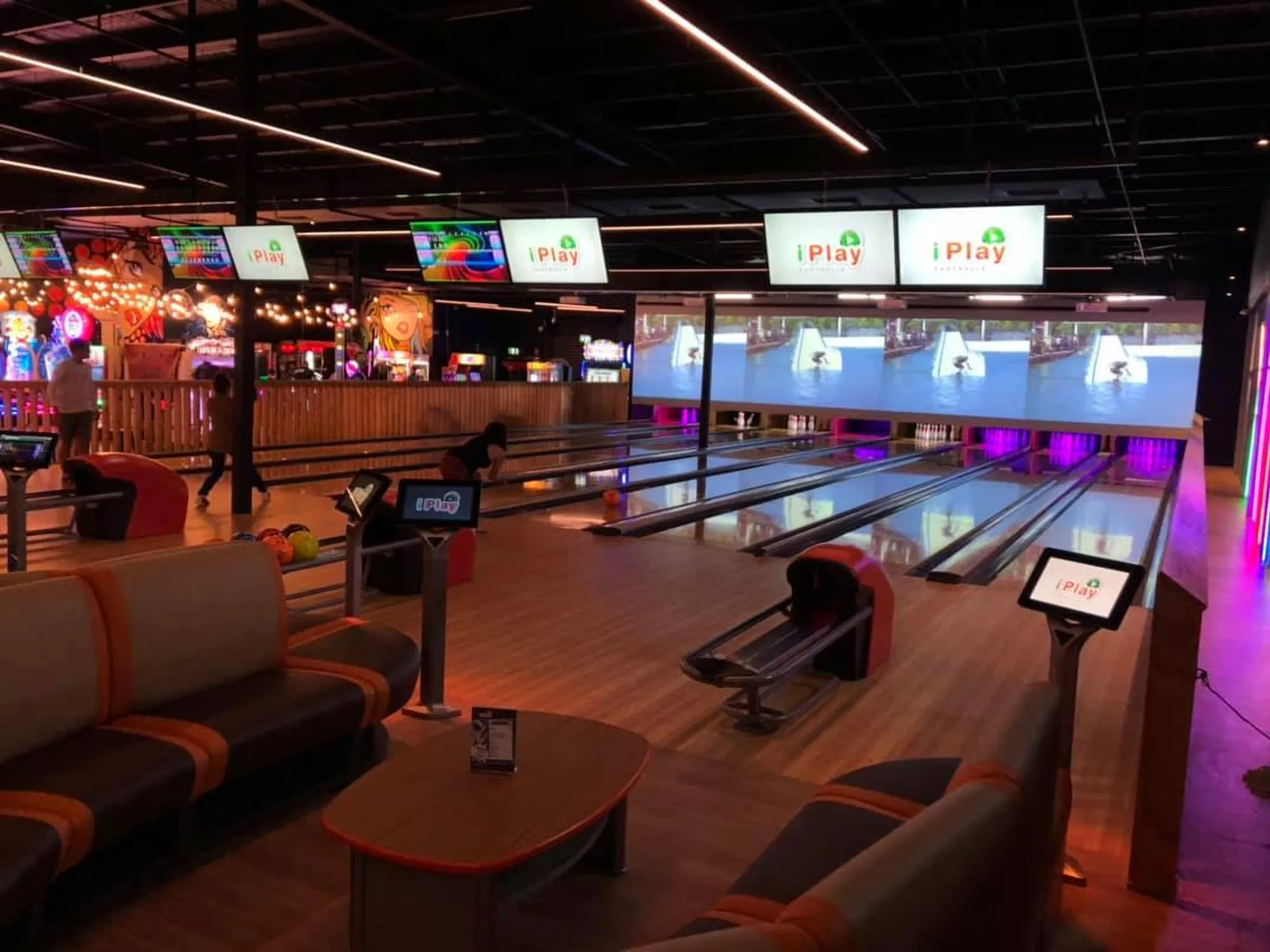 Bowling lanes with screens above them