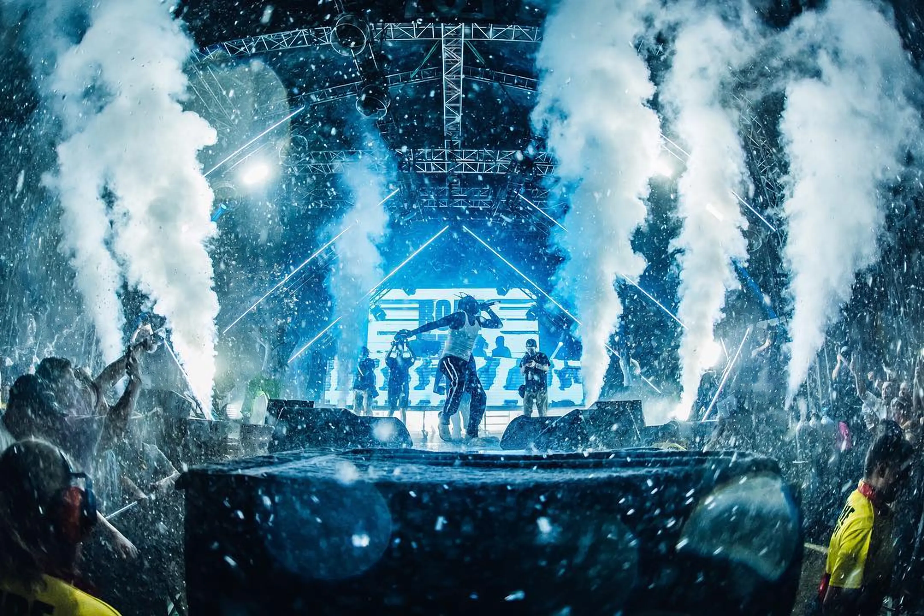 A festival stage with CO2 jets firing over the crowd